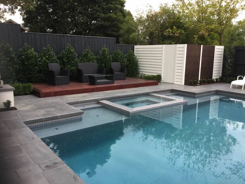 Modern residential swimming pool with Grigio porcelain mosaic tiles.