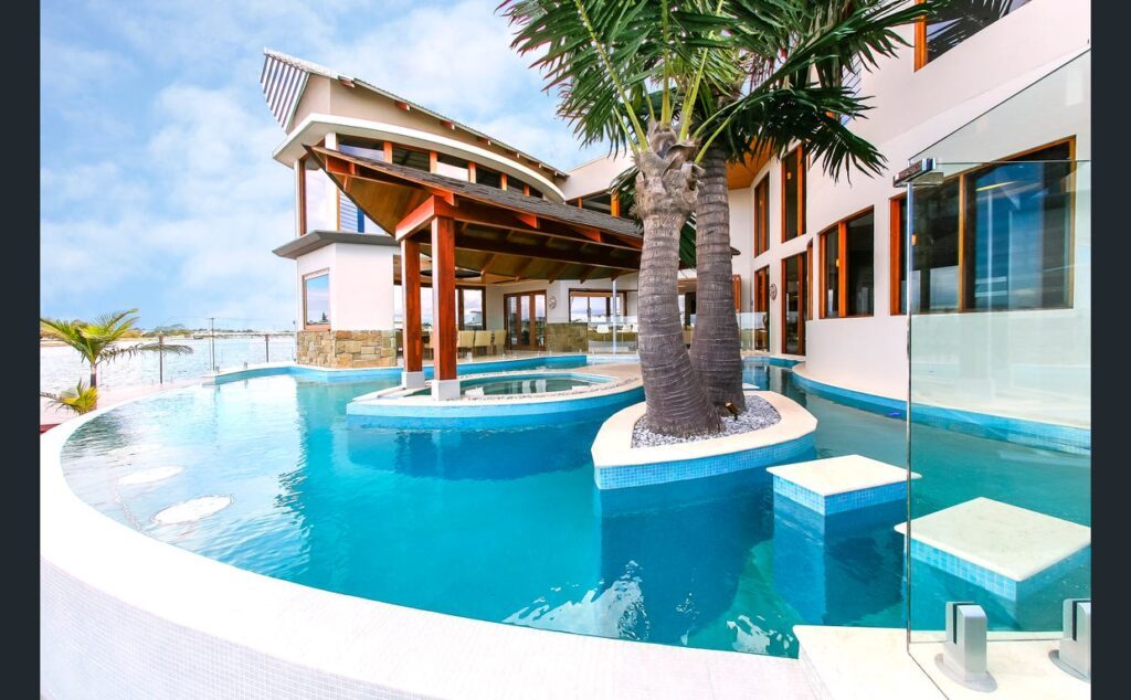Award-winning Pelican Waters swimming pool finished in Caprici WA11 Pearl Glass Mosaics