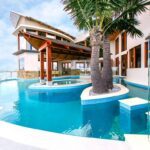 Award-winning Pelican Waters swimming pool finished in Caprici WA11 Pearl Glass Mosaics